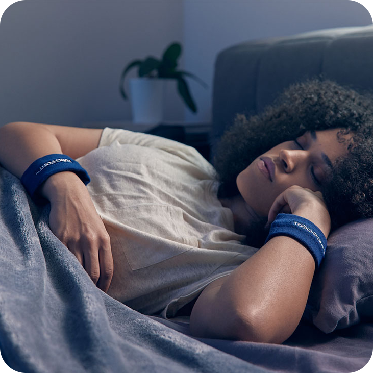 Woman sleeping with TouchPoints Sweatbands