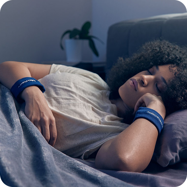 Woman sleeping with TouchPoints Sweatbands